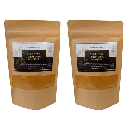 Angadi of Spices Authentic Alleppey Turmeric Powder in resealable brown pouches, 100g each, with a clear window showing the vibrant yellow spice.