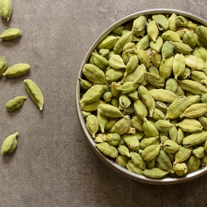 Angadi of Spices premium 8MM whole green cardamom pods (elaichi) with a bold aroma, perfect for cooking and baking.