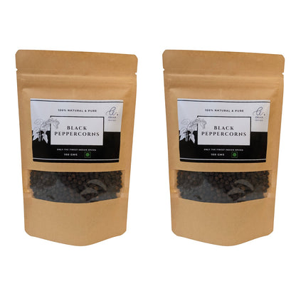 Angadi of Spices whole black peppercorns, TGSEB grade, in a resealable kraft pouch with a clear window showing the whole peppercorns.